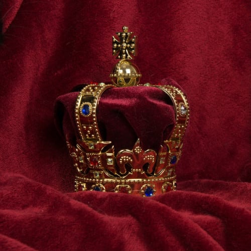 Crown on crushed red velvet. Coronation Break.